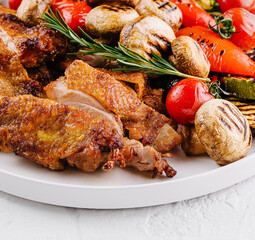 Roasted chicken dinner with grilled vegetables