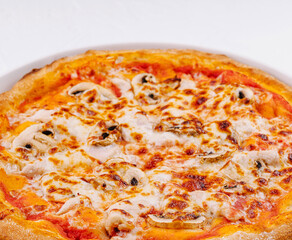 Freshly baked cheese pizza on white plate