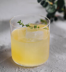 Refreshing herbal cocktail on minimalist background