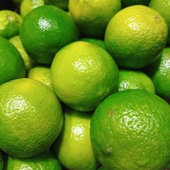 background green lemons, citrus fruit lime