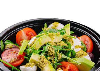 Fresh avocado salad in a black bowl