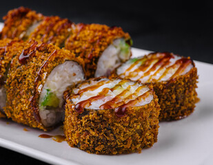 Crunchy spicy sushi roll on elegant plate