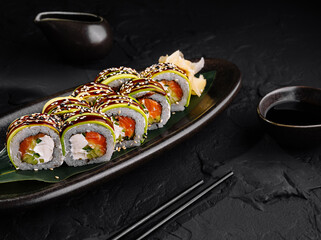 Elegant sushi platter on dark background
