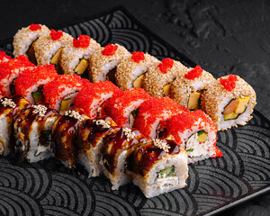 Gourmet sushi platter on modern dark plate