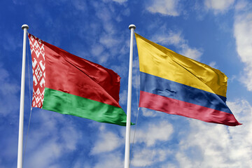 3d illustration. Belarus and Colombia Flag waving in sky. High detailed waving flag. 3D render. Waving in sky. Flags fluttered in the cloudy sky.