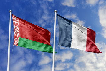 3d illustration. Belarus and France Flag waving in sky. High detailed waving flag. 3D render. Waving in sky. Flags fluttered in the cloudy sky.