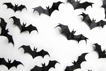 Fototapeta premium Halloween black paper bats on white background, flat lay