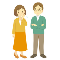 若夫婦が向かい合って困った表情で思い悩む場面、男性は腕組み（男女の全身立ち姿）
