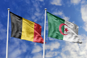 3d illustration. Belgium and Algeria Flag waving in sky. High detailed waving flag. 3D render. Waving in sky. Flags fluttered in the cloudy sky.