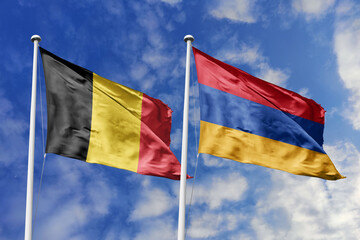 3d illustration. Belgium and Armenia Flag waving in sky. High detailed waving flag. 3D render. Waving in sky. Flags fluttered in the cloudy sky.