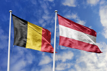 3d illustration. Belgium and Austria  Flag waving in sky. High detailed waving flag. 3D render. Waving in sky. Flags fluttered in the cloudy sky.
