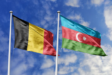 3d illustration. Belgium and Azerbaijan Flag waving in sky. High detailed waving flag. 3D render. Waving in sky. Flags fluttered in the cloudy sky.