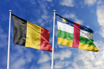 3d illustration. Belgium and Central African Republic Flag waving in sky. High detailed waving flag. 3D render. Waving in sky. Flags fluttered in the cloudy sky.