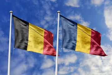 3d illustration. Belgium and Chad Flag waving in sky. High detailed waving flag. 3D render. Waving in sky. Flags fluttered in the cloudy sky.