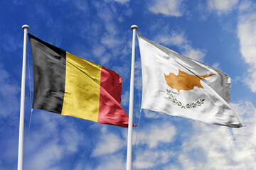 3d illustration. Belgium and Cyprus Flag waving in sky. High detailed waving flag. 3D render. Waving in sky. Flags fluttered in the cloudy sky.