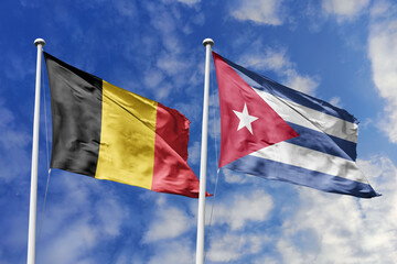 3d illustration. Belgium and Cuba Flag waving in sky. High detailed waving flag. 3D render. Waving in sky. Flags fluttered in the cloudy sky.