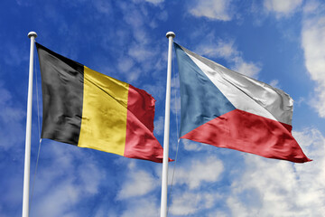3d illustration. Belgium and Czech Republic Flag waving in sky. High detailed waving flag. 3D render. Waving in sky. Flags fluttered in the cloudy sky.