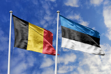 3d illustration. Belgium and Estonia Flag waving in sky. High detailed waving flag. 3D render. Waving in sky. Flags fluttered in the cloudy sky.