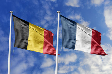 3d illustration. Belgium and FranceFlag waving in sky. High detailed waving flag. 3D render. Waving in sky. Flags fluttered in the cloudy sky.