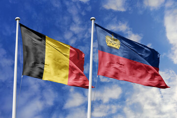 3d illustration. Belgium and Liechtenstein Flag waving in sky. High detailed waving flag. 3D render. Waving in sky. Flags fluttered in the cloudy sky.