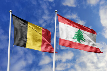 3d illustration. Belgium and Lebanon Flag waving in sky. High detailed waving flag. 3D render. Waving in sky. Flags fluttered in the cloudy sky.
