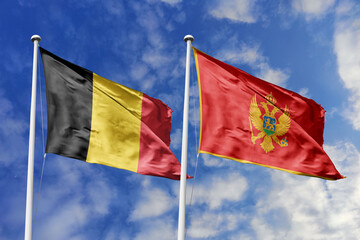 3d illustration. Belgium and Montenegro Flag waving in sky. High detailed waving flag. 3D render. Waving in sky. Flags fluttered in the cloudy sky.