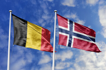 3d illustration. Belgium and Norway Flag waving in sky. High detailed waving flag. 3D render. Waving in sky. Flags fluttered in the cloudy sky.