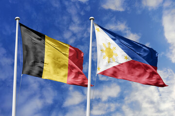 3d illustration. Belgium and Philippines Flag waving in sky. High detailed waving flag. 3D render. Waving in sky. Flags fluttered in the cloudy sky.