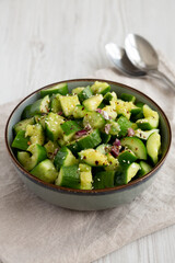 Homemade Smashed Cucumber Salad in a Bowl, side view.