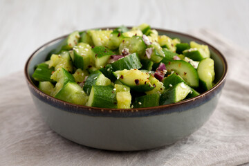 Homemade Smashed Cucumber Salad in a Bowl, side view.