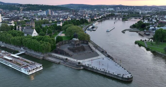 Aerial drone view of the deutsche Eck, monument in the city of Koblenz, Germany at sunset.