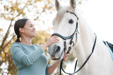 Smile, horse and happy woman on farm for care, love and passion for recreation. Holding harness,...