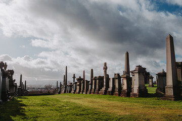 Glasgow Scotland: 12th Feb 2024: Glasgow Necropolis on sunny winter day with industrial looking...