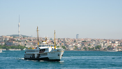 Passenger ship on the sea with Televisin Tower, buildings in İstanbul. Open space area. Selective focused.