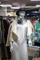 Fashion design mannequin showcasing formal wear in a boutique store