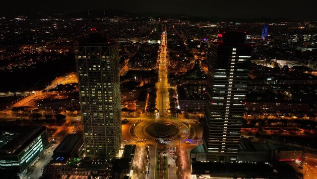 Aerial drone panorama of Villa Olimpica del Poblenou, in the city of Barcelona. Twin skyscrapers of Hotel Arts and Torre Mapfre next to Port Olimpic.	