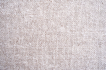 Beige fabric with a subtle crosshatched texture and fine weaving pattern