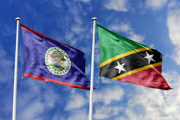 3d illustration. Belize and Saint Kitts and Nevis Flag waving in sky. High detailed waving flag. 3D...