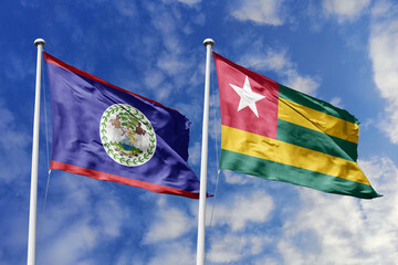 3d illustration. Belize and Togo Flag waving in sky. High detailed waving flag. 3D render. Waving...