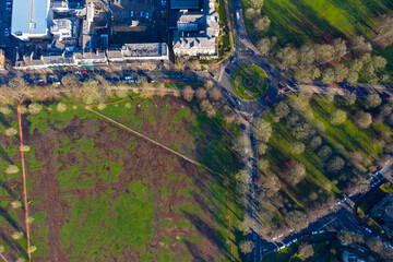 Aerial photo of the town centre of Harrogate in the UK showing a muddy playing field known as the...