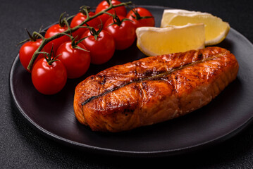 Fresh cooked delicious salmon steak with spices and herbs