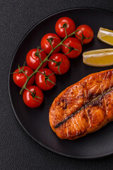 Fresh cooked delicious salmon steak with spices and herbs
