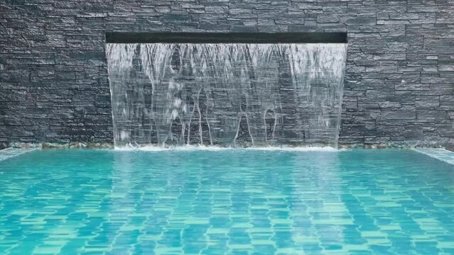 artificial waterfall in swimming pool, dolly zoom, slow motion
