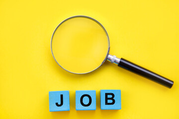 Job search and job hunting concept; Magnifier glass and job word 