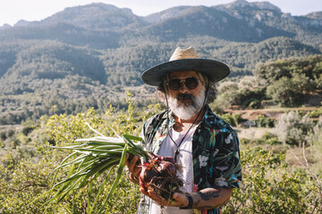 Fresh vegetables straight from the garden. The gardener admires his own crops.