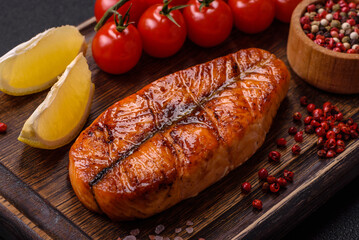 Fresh cooked delicious salmon steak with spices and herbs