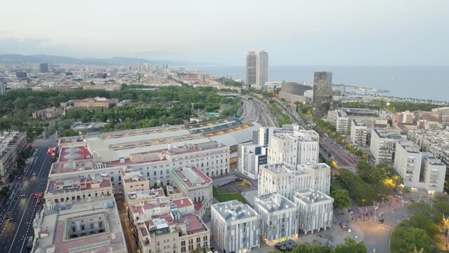 Aerial view of Barcelona, Catalonia, Spain. Landscape panorama of residential buildings, parks and streets. Parc de la Ciutadella, Estaci&oacute;n de Francia, Torre Mapfre, Hotel Arts. Drone footage.