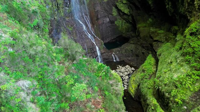 Majestic Risco Waterfall on a sunny day in Rabacal, Paul da Serra, Madeira Island, Portugal