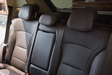 Obraz premium Car back seat with headrest and arm rest, a comfortable automotive fixture