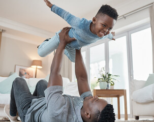 Dad, boy and smile with lifting in living room for bonding, love and trust for support and child...
